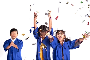 children celebrating graduation